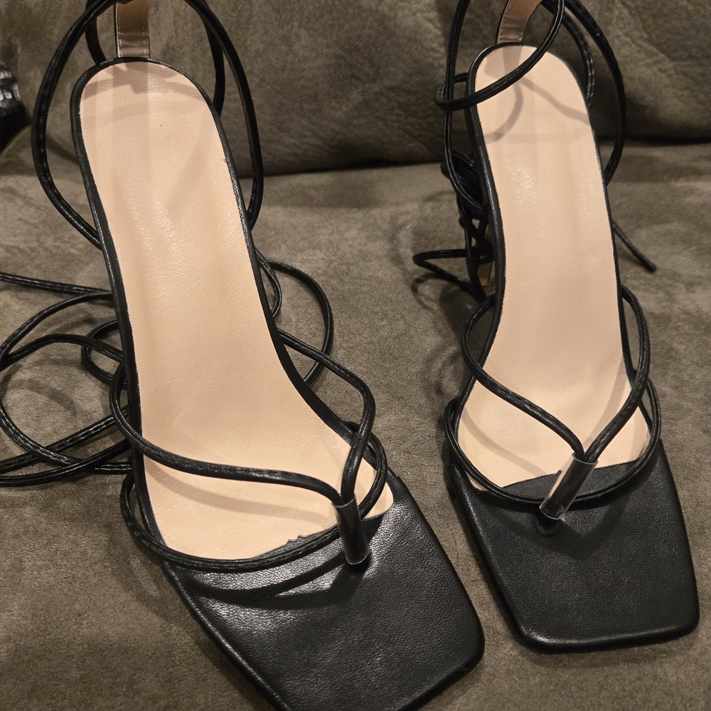 Strappy black shoes.Size 38 preowned in good condition.